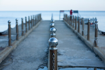 View of the metal fence on the seawall