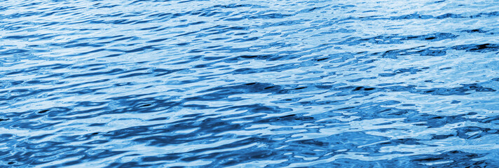 Sea surface. Blue water texture. Close up blue water surface