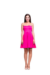 Full body length size vertical of smiling brunette girl, lady in mini pink dress and high heels shoes, standing straight. Isolated over bright vivid turquoise background