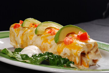 Wet Burrito Burrito mojado avocado on top