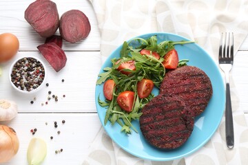 Vegetarian product. Tasty beetroot cutlets served on white wooden table, flat lay
