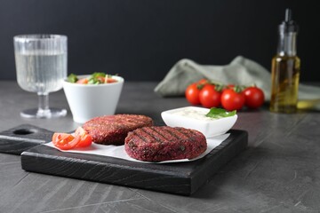 Tasty fried vegetarian cutlets served on grey table