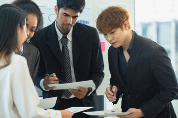 Co-workers working teamwork together concept. Asia young creative people stand together at startup.