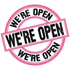 WE'RE OPEN text on pink-black round stamp sign