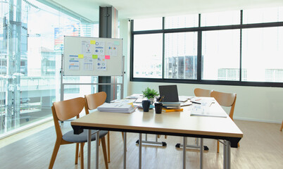 Laptop at office desk, graphs and charts, analysis report chart in office workspace.