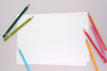 landscape white paper and pencils mock up