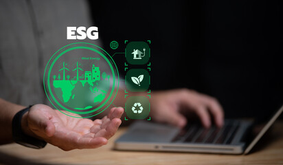 ESG environment social governance investment business concept,Asian man sitting using a computer to analyze ESG,Environment world day.