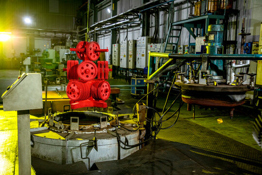 gas carburizing furnace, hardening process of metal parts controlled cooling with oil and water quenching, hot red heated forged iron steel components pieces dipping in water oil bath with scada