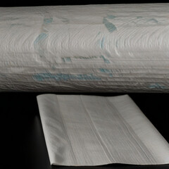 Roll of paper kitchen towels isolated on black