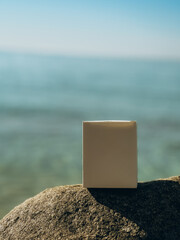 White box on the beach against the sea