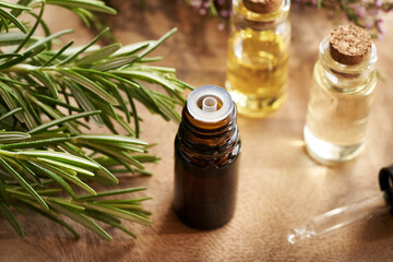 A bottle of rosemary essential oil on a table