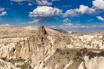 Fototapeta na wymiar A scene of Cappadocia under the cloudy blue sky