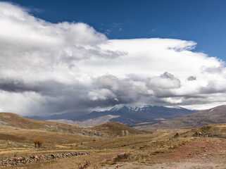 Fototapeta premium Clouds over the mountains in spring for the purpose of web and design use