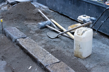 pavement being laid with builders tools and equipment