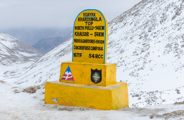 Sign marking the summit of Khardung La pass, at 17,582 feet one of the world's highest motorable roads