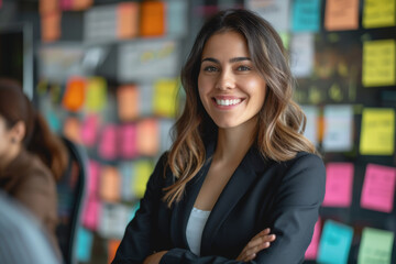 Happy Latin project manager woman holding brainstorming with colleagues in the office boardroom.
