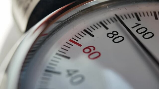 very close-up of the dashboard of an analog device for measuring pulse and blood pressure in humans. home tonometer. In extreme close-up measuring blood pressure with a sphygmometer