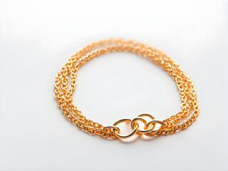 Obraz premium A pair of gold bracelets, gold jewelry, on a solid color background, with concepts of love and marriage, Valentine's Day