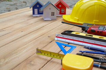 Architectural plan in top view of engineer at wooden table