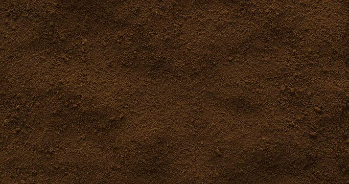 Background texture of powdered birch fungus chaga. Chaga tea is a strong antioxidant, boosts immune system, and has detox quality. Table spin. 