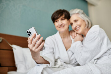Elderly women capturing a moment with her cell phone.