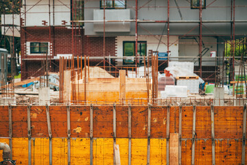 Building construction site with scaffold and reinforcement steel bars