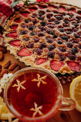 Homemade berry tart with Frangipane cream on the table 