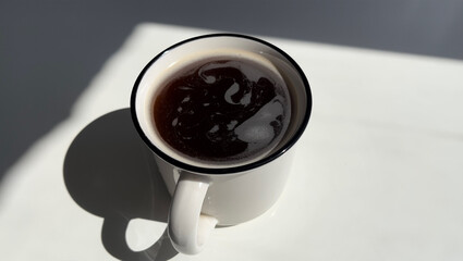 Steaming cup, aromatic brew, cozy ambiance. Morning ritual captured, perfect for coffee-themed projects