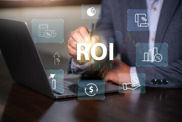 Return on investment (ROI) , Businessman using a sofware to analysis investment to get high  return.