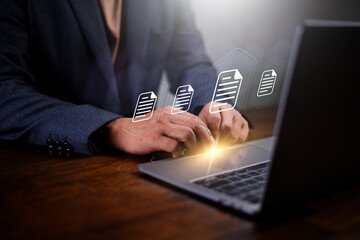 Electronics document and paperless concept. Man using using software to manage a eletronics document. Document management system and process automation.