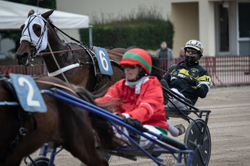 Group of jockeys race on the track of the Bologna Hippodrome