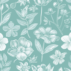 a blue and white flower pattern on a green background