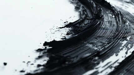 Evocative and enigmatic: mysterious black brush strokes emerge on a blank white surface.