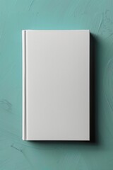 White book cover mockup centered on a textured teal background