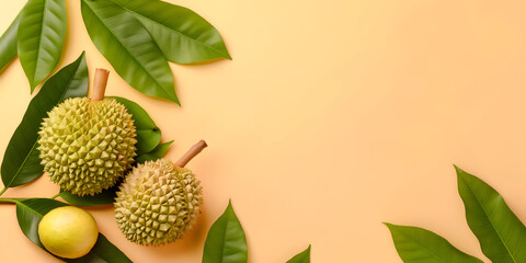 Durian pieces and whole fruit on peach background with copy space, great for summer themes and tropical fruit marketing