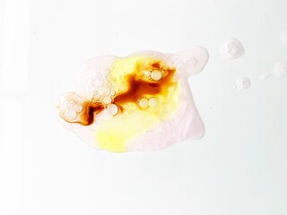 Fototapeta na wymiar Hydrate Hyaluronic Acid Moisturizer Smear. Clear Drop of Liquid. A smear of colorful chemical products on a white background 
