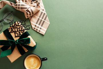 Happy Fathers Day concept. Flat lay tie, glasses, gift box with Happy Fathers Day topper, coffee...