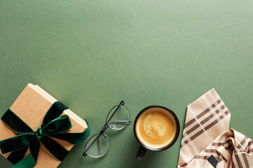 Flatlay composition with tie, gift box, coffee cup, glasses on dark green background. Happy Fathers...
