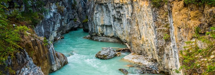  Nature's Gem: Turquoise Mountain Stream Flowing Through Marble Canyon, Kootenay National Park,...