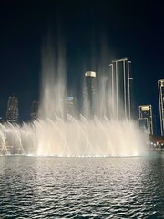 City fountains show, night time, illumination, water performance