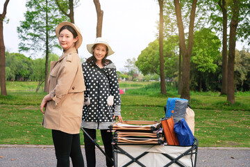 Leisure Time in the Park: Stylish Duo with a Picnic Cart