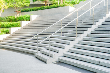 Fototapeta premium Empty Staircase to blue sky at rooftop and garden in morning,Long stair concrete in office building.
