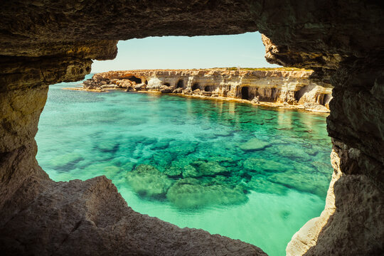 Sea cave arch viewpoint near Cape Greko, Capo Greco, Ayia Napa and Protaras on Cyprus island, Mediterranean Sea. Breathtaking seascape. Turquoise crystal clear waters in sunny day