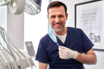 Portrait of male dentist at the dentist's office