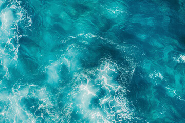 Aerial view of a turquoise water surface texture in a flat lay shot from a top down perspective in...