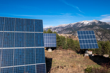 Solar panels harnessing renewable energy with the picturesque Pedraforca mountain peak in the backdrop, showcasing a harmonious blend of technology and nature in Catalonia, Spain