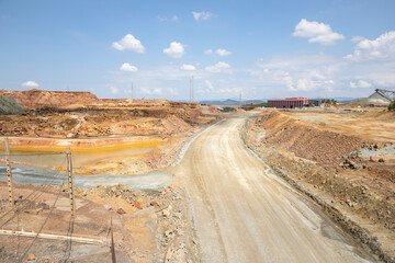a dirt road in the open pit mining exploration yard at Minas de Riotinto, province of Huelva,...