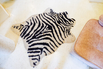 Zebra rug With Fur on floor, zebra stripe mat, Winter weekend concept,top view,home interiors,Space...