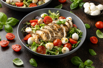 Chicken caprese salad with tomato, mozzarella and balsamic dressing