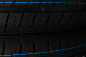 Car tire close up. Sport car tyre background. Car tyre texture.